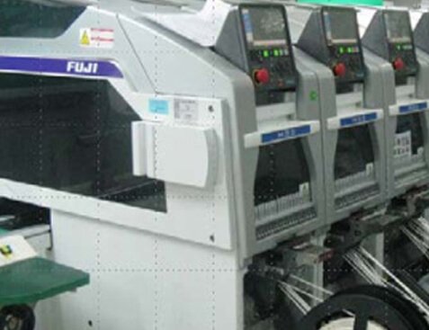 FUJI SMT pick-and-place machine line on the manufacturing production floor
